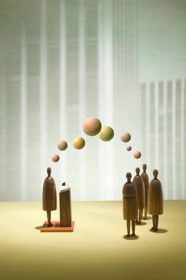Stick figures listening to a leader